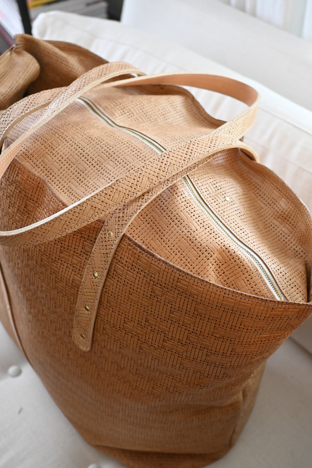 Up close to the Weaved Leather Weekender Tote in Beige 